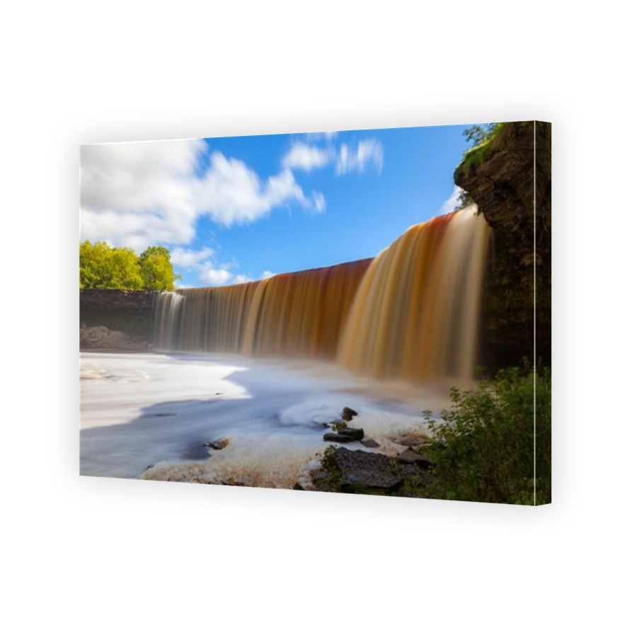 Jagala is the biggest waterfall in Estonia. Long exposure day shot. Close up. Water is red due to swamp organics.