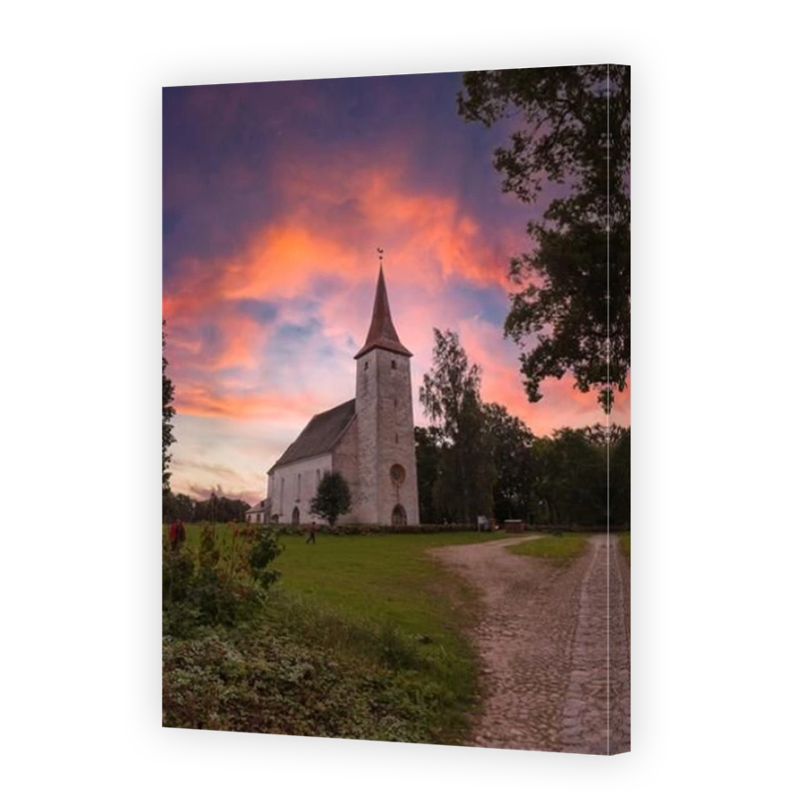 Amazing sunrise sky over high rural church in Suure-Jaani, Estonia.