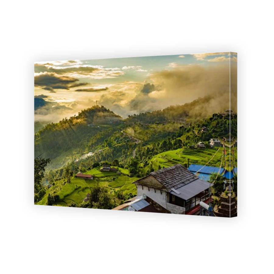 A village on the mountains under the light of sunrise through clouds