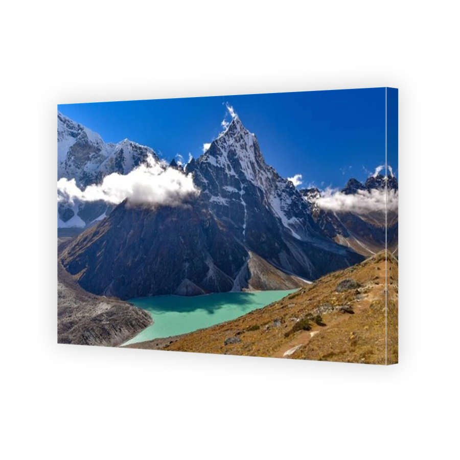 Lake surrounded by snow mountains of Himalayas in Nepal