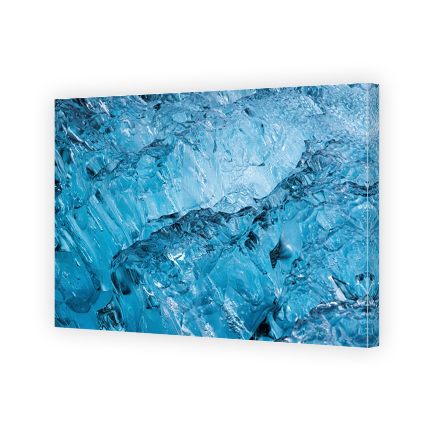 Abstract blue ice cracks from iceberg in glacier natural background