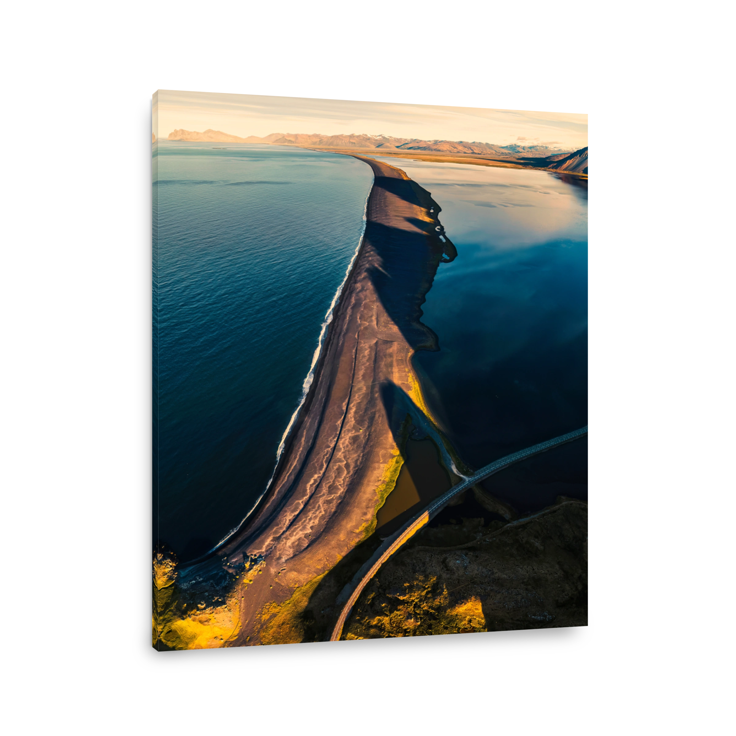 Beautiful sunrise over volcanic mountain range in rural scene by the ocean of peninsula at summer in Iceland