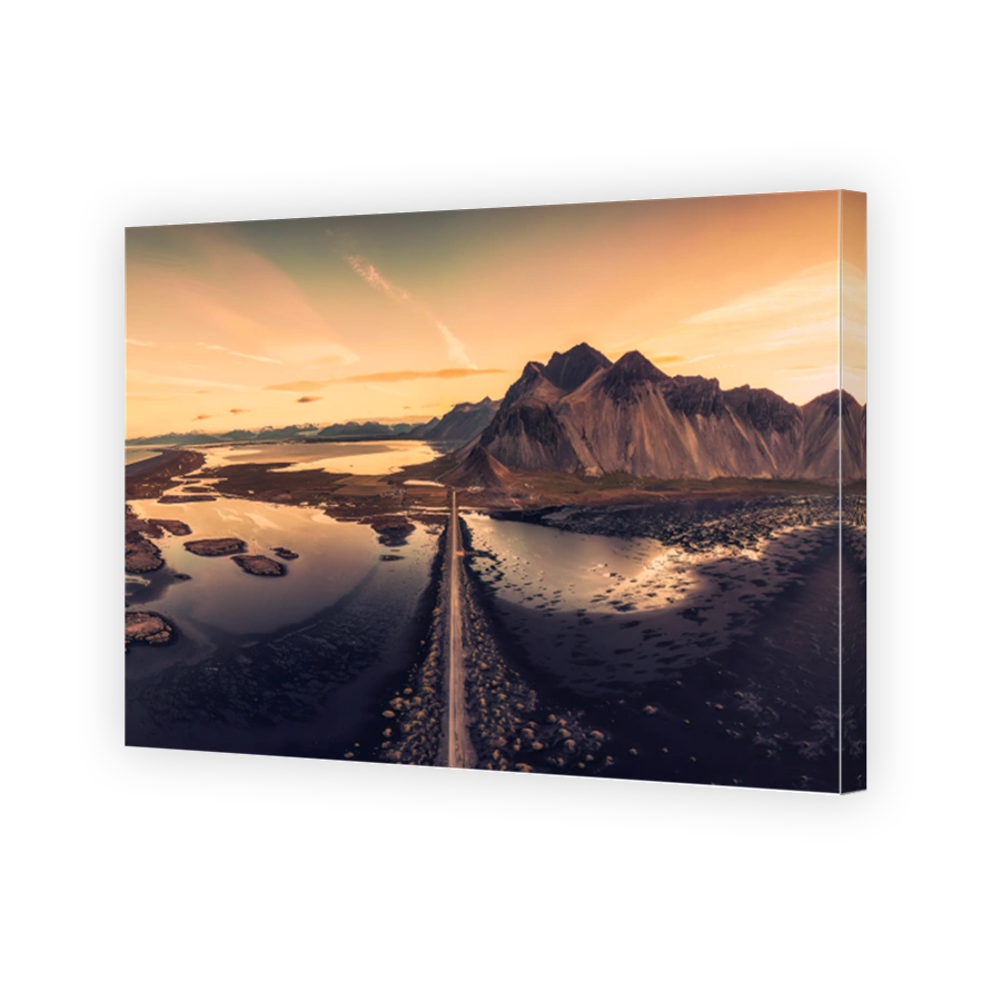 Beautiful sunrise over Vestrahorn mountain viking village and road among black sand beach in Stokksnes on summer at Iceland