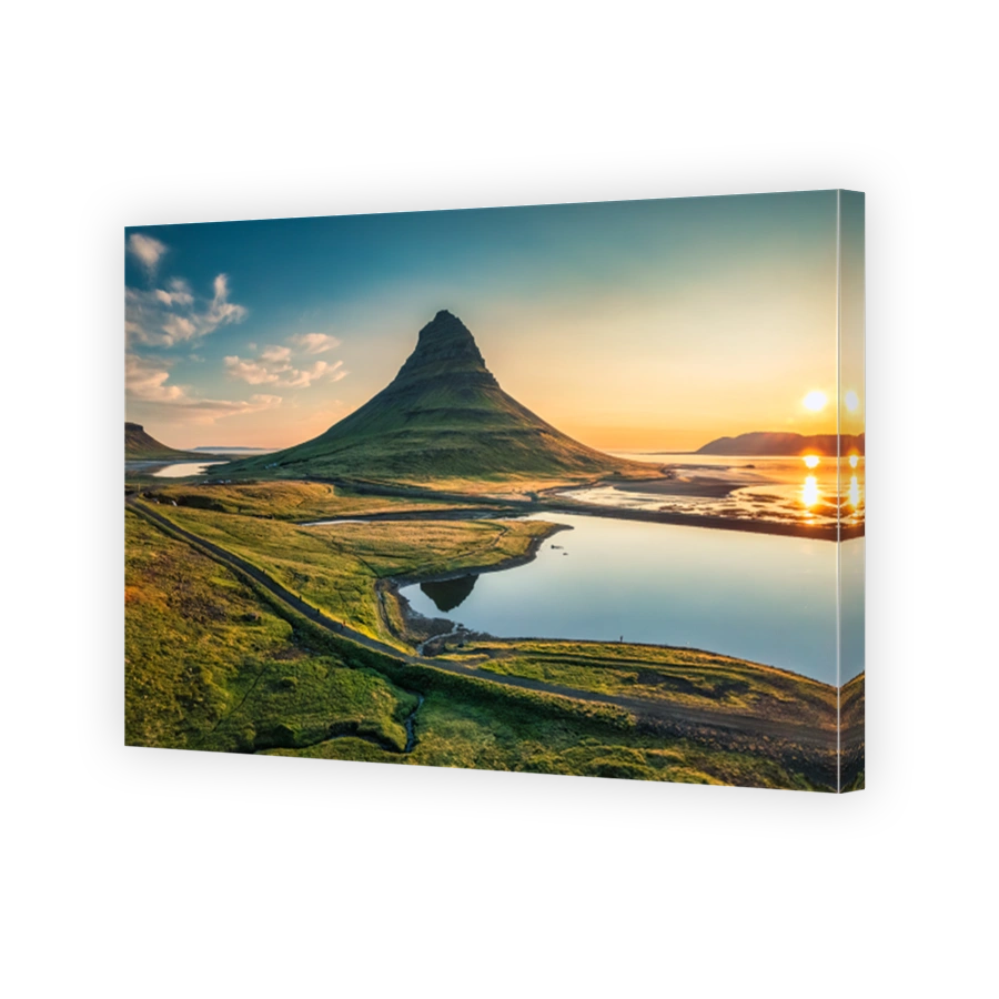 Volcano Kirkjufell mountain with lake reflection during sunrise morning in summer at Iceland