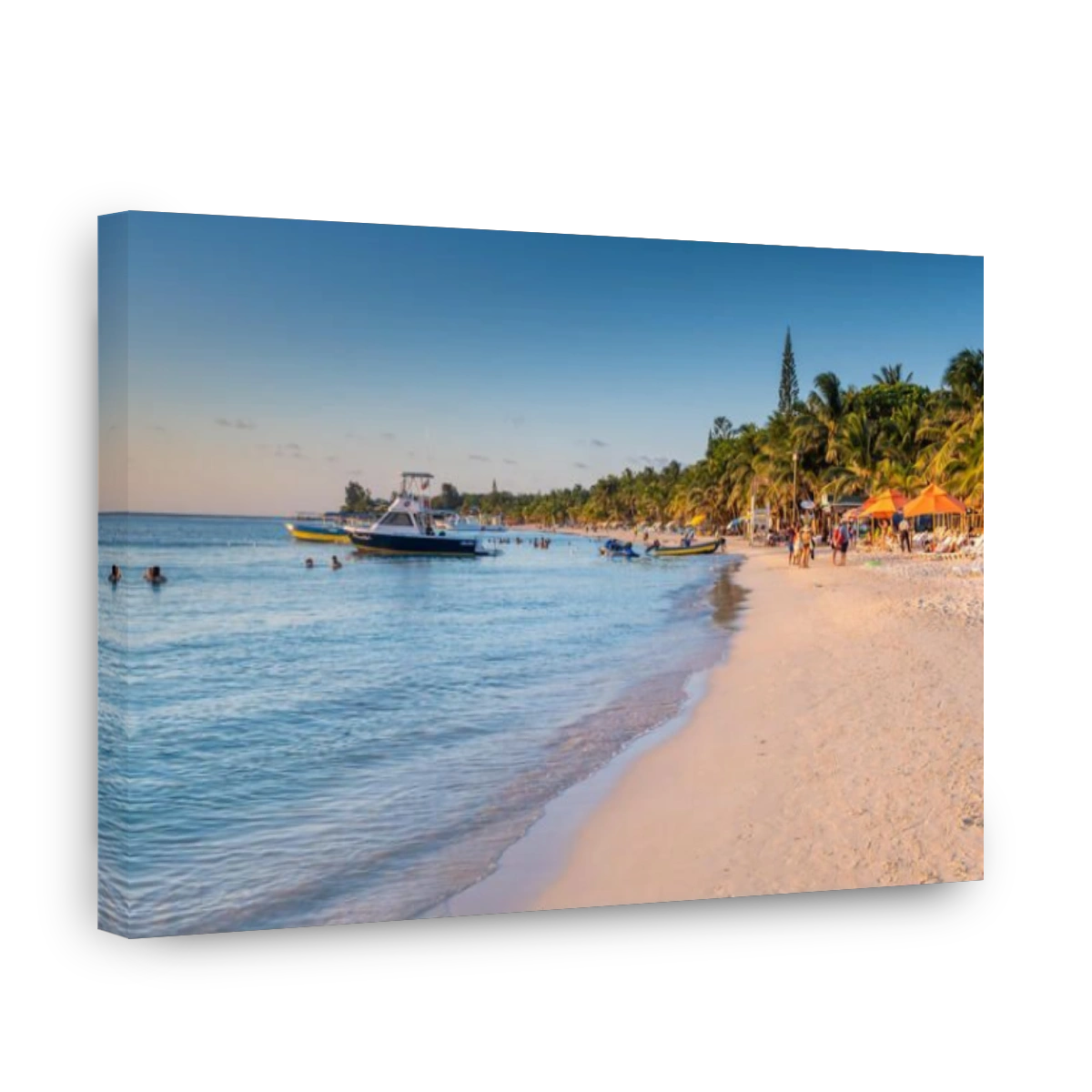 Beautiful sunset casts warm light on West Bay Beach in Roatan Honduras.
