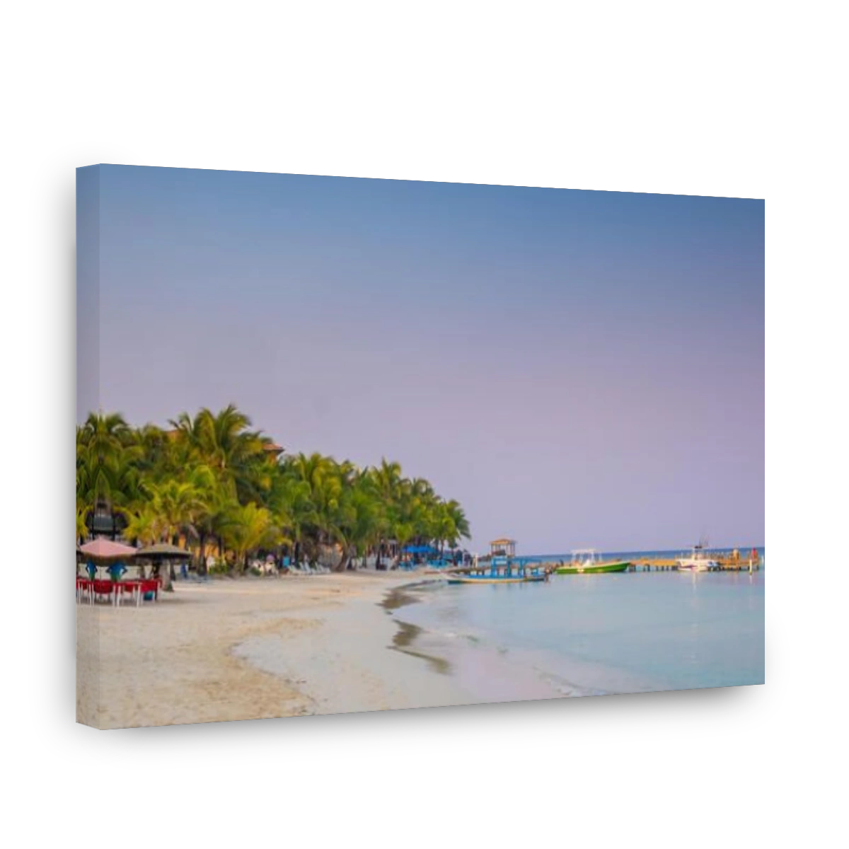 West Bay Roatan Honduras at dawn with few people on the beach.