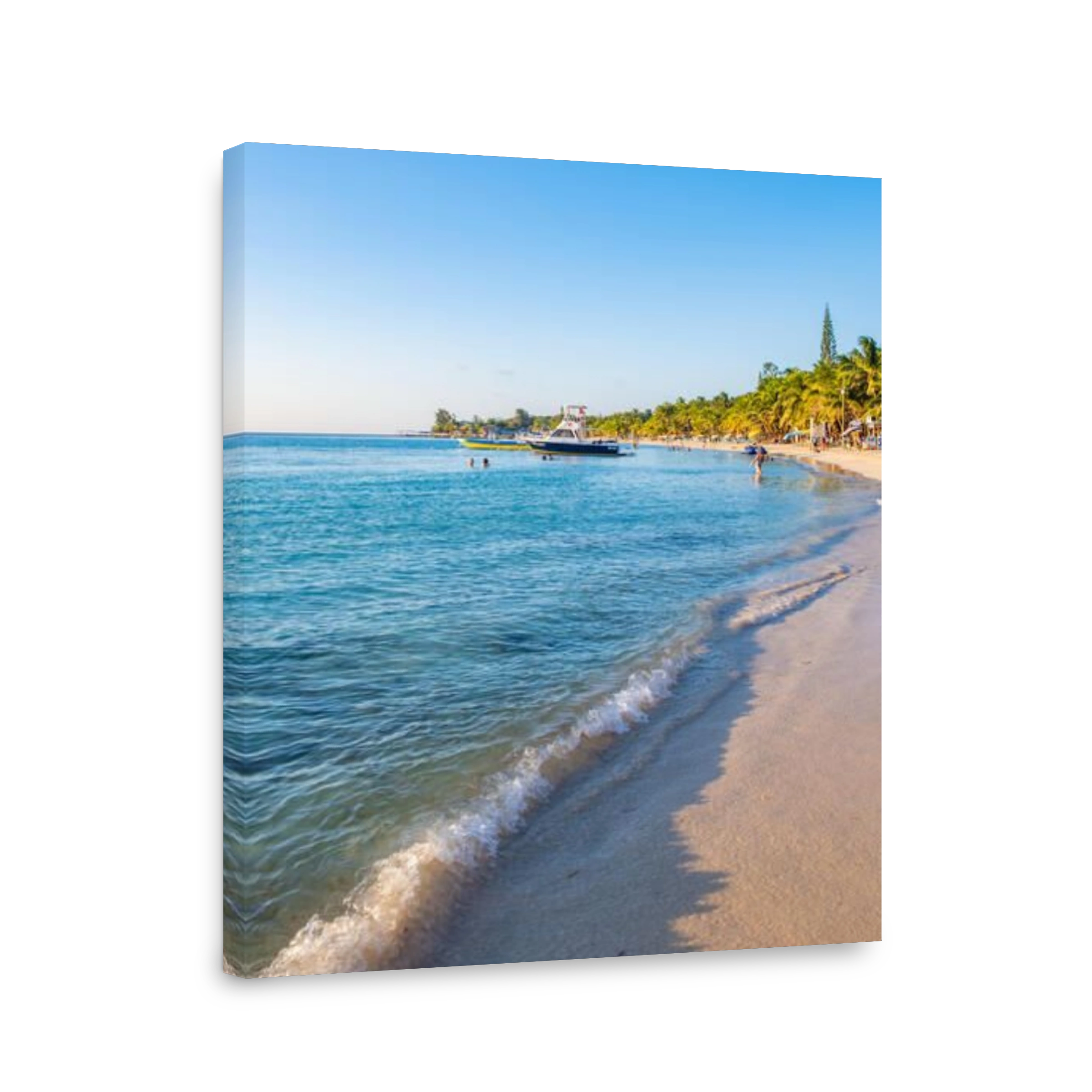 View down West Bay Beach in Roatan Honduras at sunset in portrait orientation.