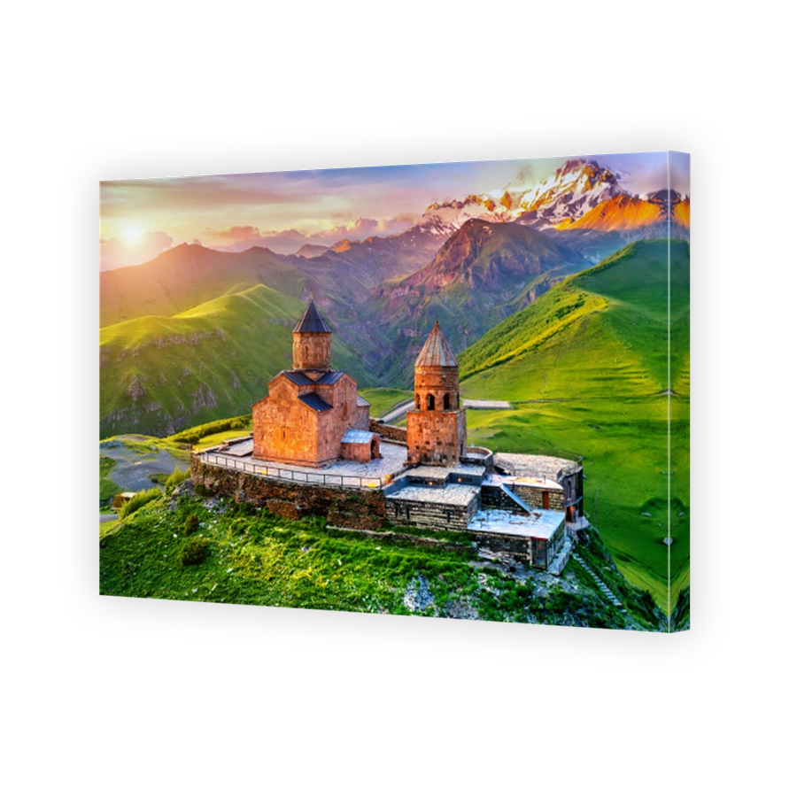 Aerial view of Gergeti trinity church at sunrise in Georgia.