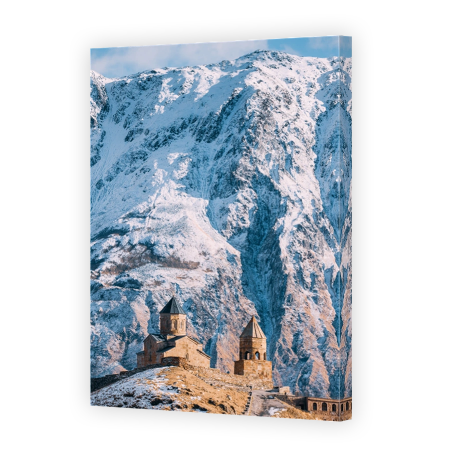 Stepantsminda, Georgia. Famous Gergeti Trinity Tsminda Sameba Church In Early Winter