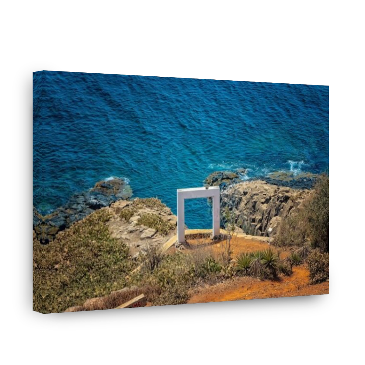 White gate or wedding arch on a large cliff high above the sea on Goree Island, Senegal. It's near Dakar, Africa