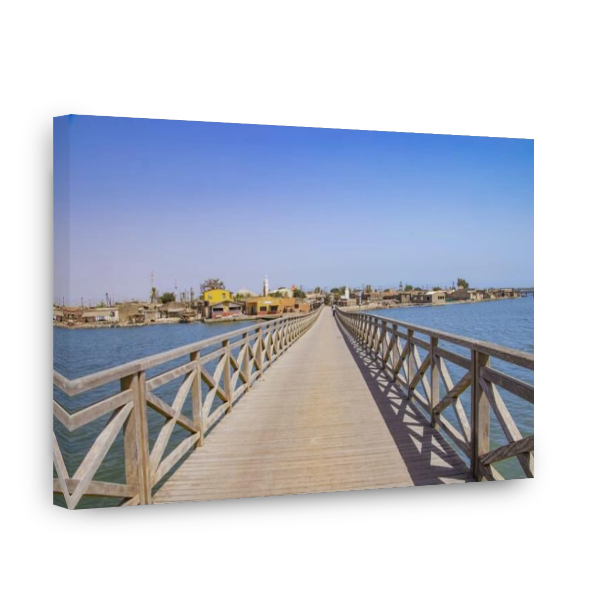 Long wooden bridge leading over a sea lagoon. It leads to Fadiouth Island in Senegal, Africa. It is a beautiful natural background.