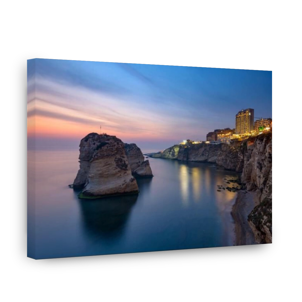 LEBANON, BEIRUT, RAS BEIRUT, PIGEON ROCK (RAOUCHE) AT DUSK