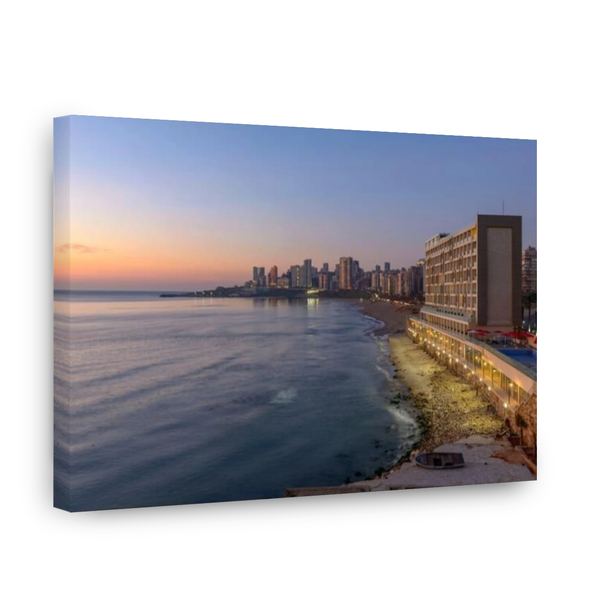LEBANON, BEIRUT, MOUSSAITBEH, RAMLEH AL BAYDA BEACH (BEIRUT PUBLIC BEACH) AND LANCASTER EDEN BAY HOTEL AT DUSK