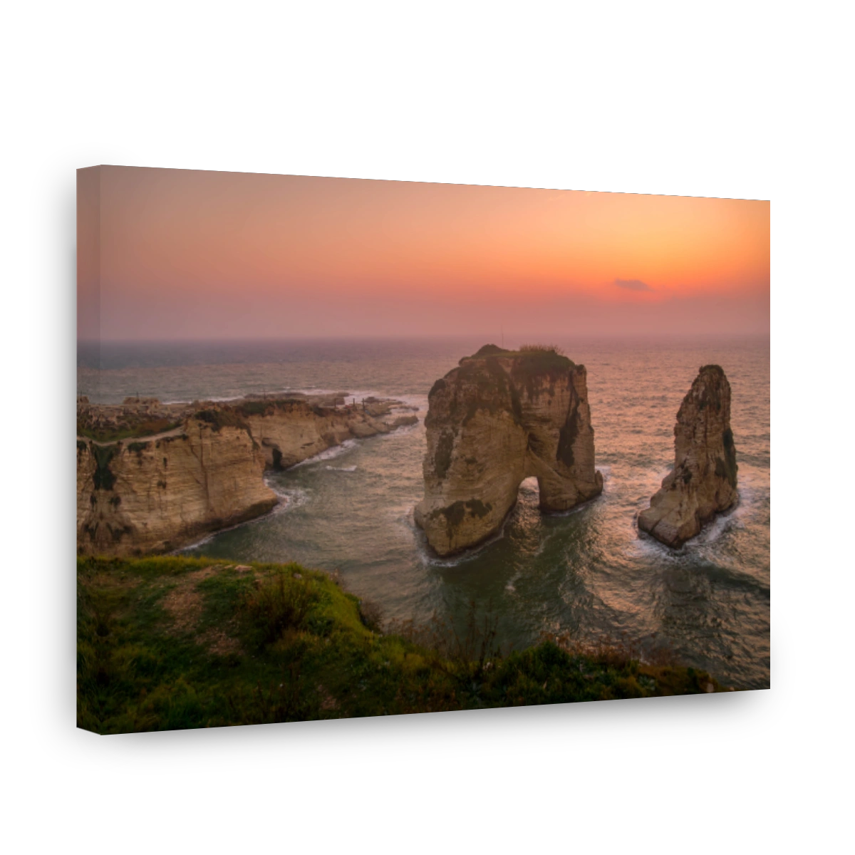 The scenic view of Pigeons' Rock (Raouche rocks), Beirut landmark on the Mediterranean sea coast, during the beautiful sunset