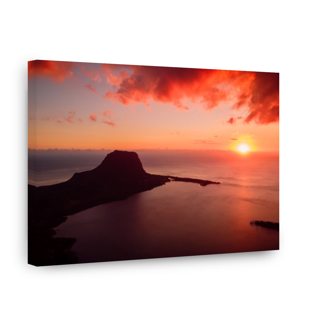 Colorful sunset and Le Morn mountain with ocean in Mauritius. Aerial view