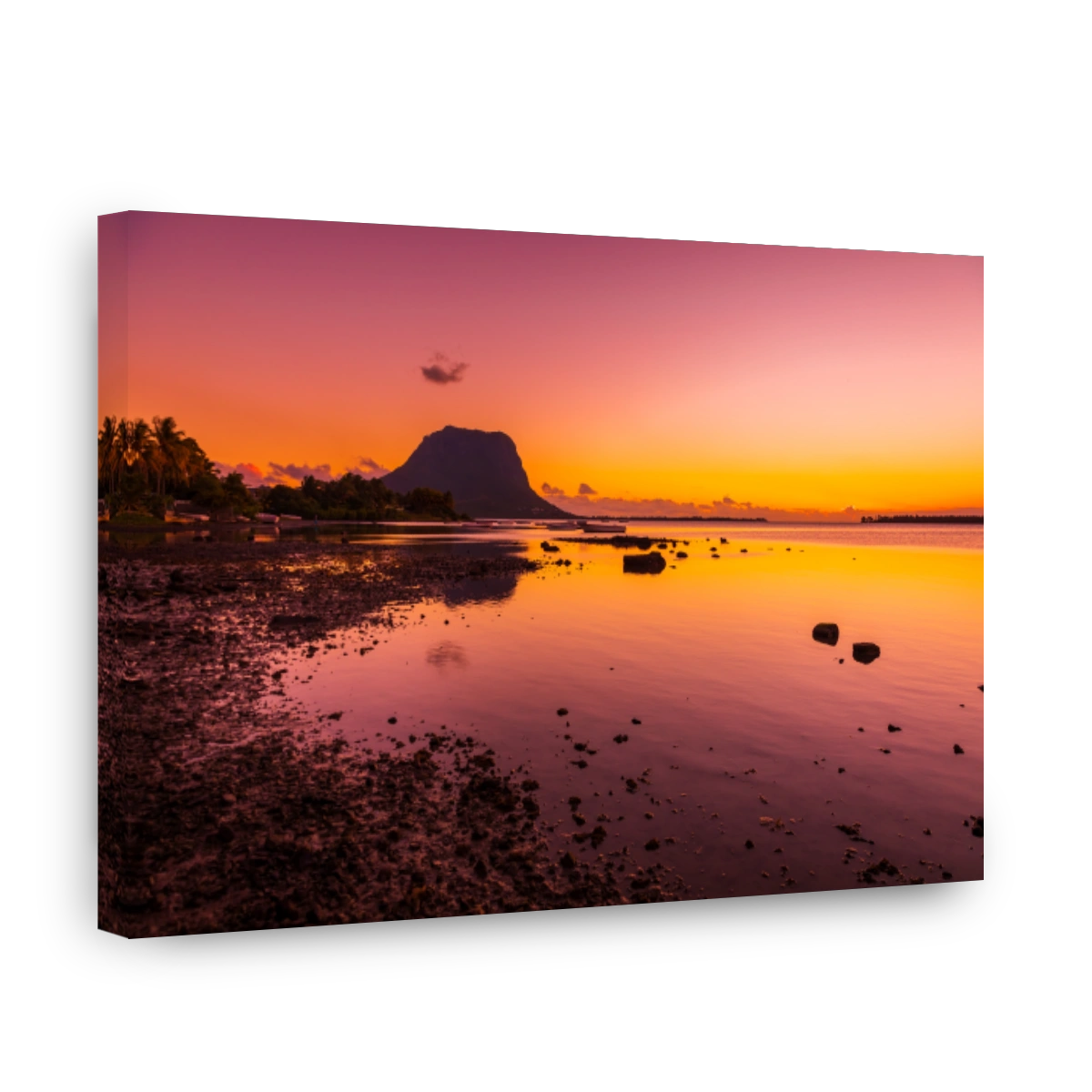Quiet ocean at low tide and colorful sunset time. Le Morn mountain in Mauritius.