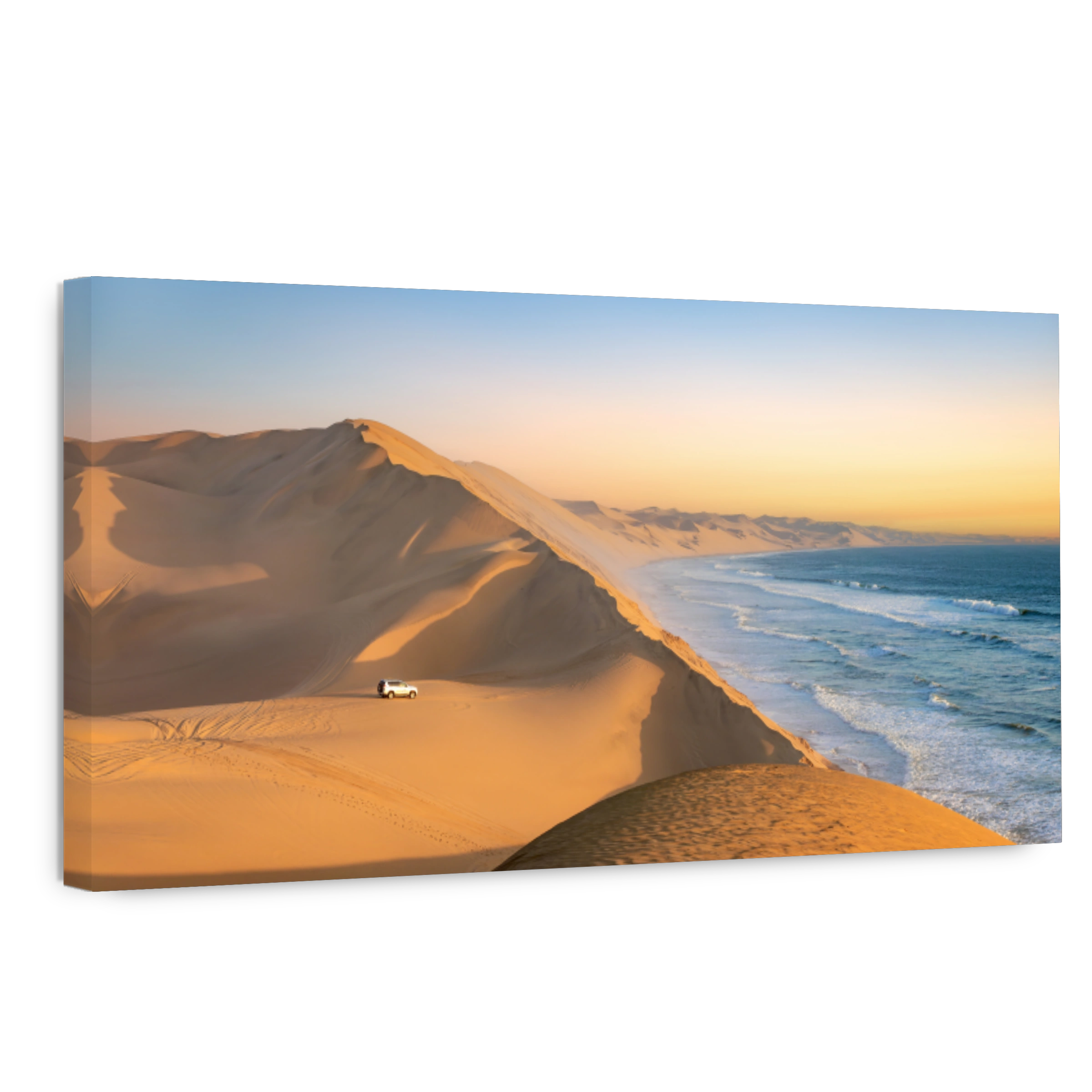 Car in the sand dunes and ocean view in Sandwich Harbour, Namib Naukluft Natural Park landscape in Namibia, Africa