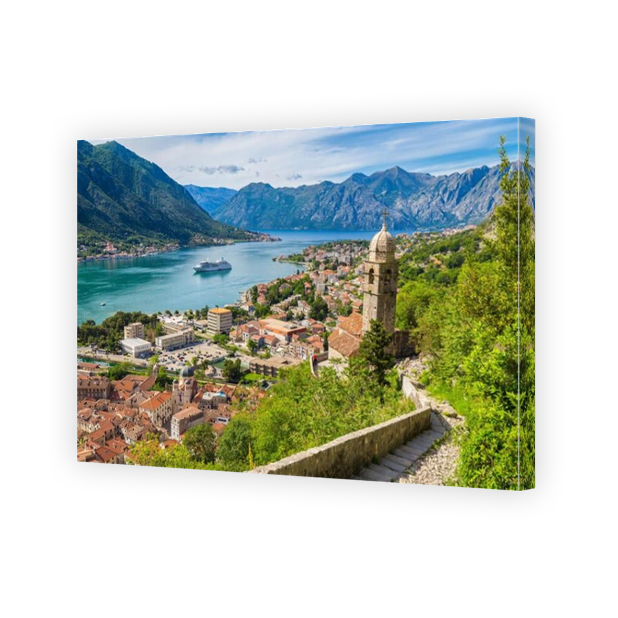 Scenic panoramic view of the historic town of Kotor with famous Bay of Kotor on a beautiful sunny day with blue sky and clouds, Montenegro, Balkans