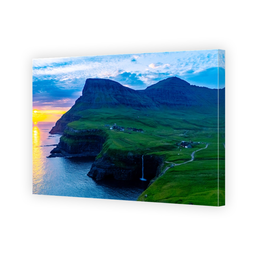 Majestic sunset at Mulafossur Waterfall near Gasadalur village in the Faroe Islands
