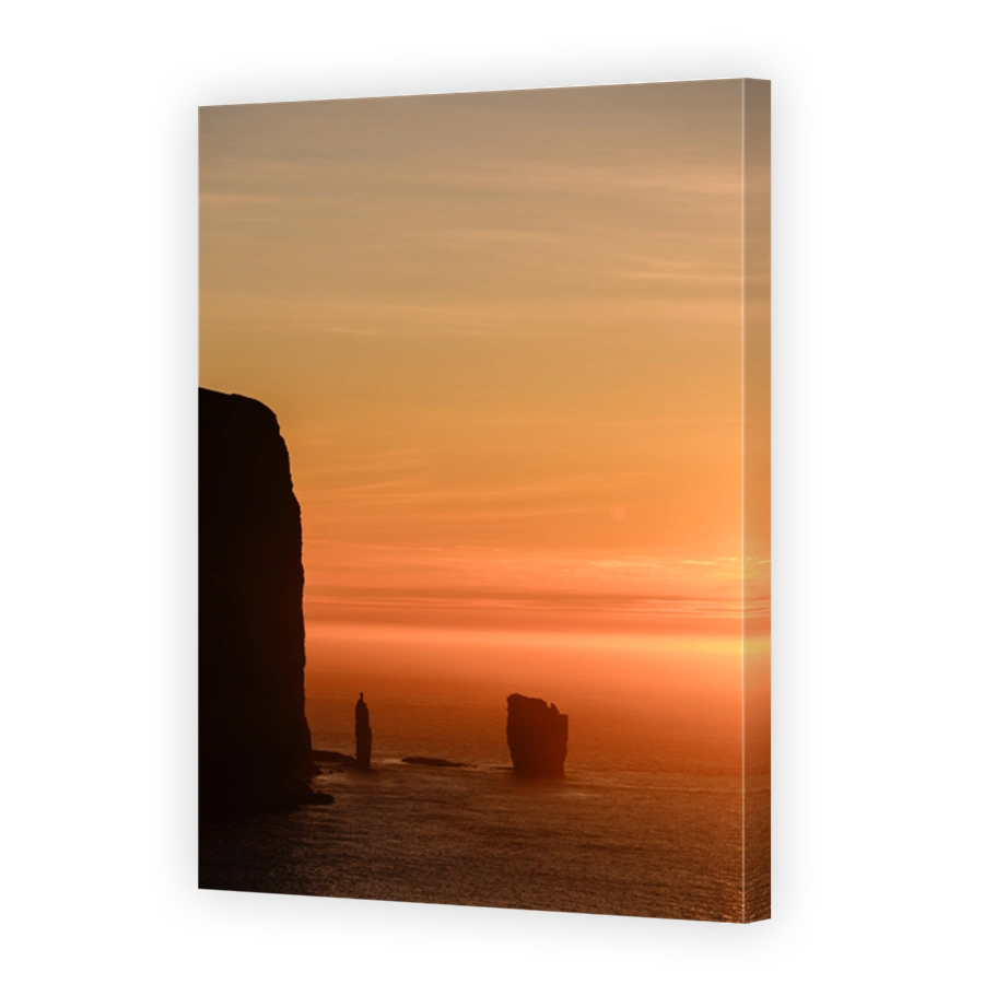 Majestic sunset over Risin og Kellingin rock formations in Faroe Islands