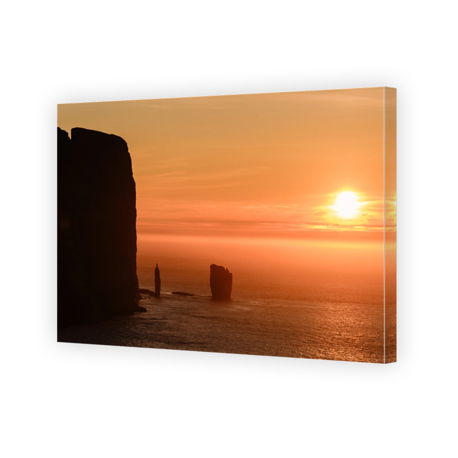 Majestic sunset illuminating Risin og Kellingin in Faroe Islands coastal beauty