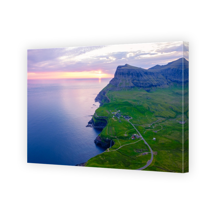 Majestic cliffs and serene waters at sunset in the breathtaking Faroe Islands