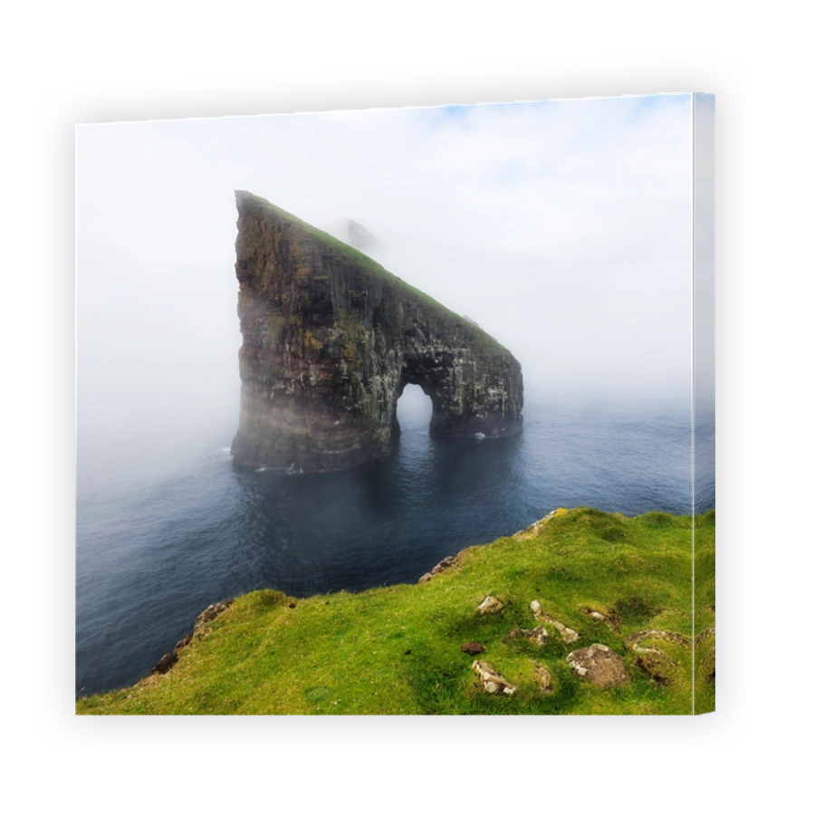 The beautiful Drangarnir Arch on the Faroe Islands, Atlantic ocean landscape with cliff