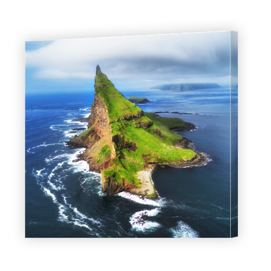 Faroe Islands Vagar, aerial drone view of Tindholmur island during sunset in North Atlantic Ocean. Faroe Islands, Denmark, Europe.