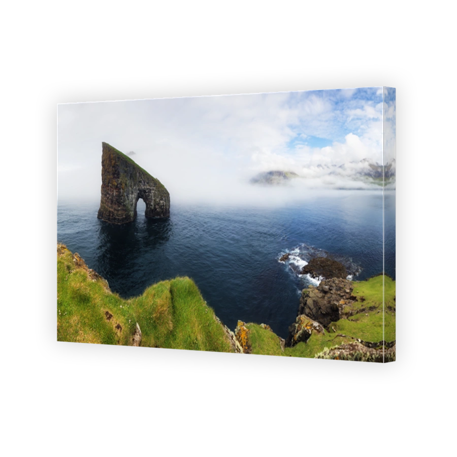 Faroe Island panorama with atlantic ocean and coast cliff, Drangarnir, Denmark