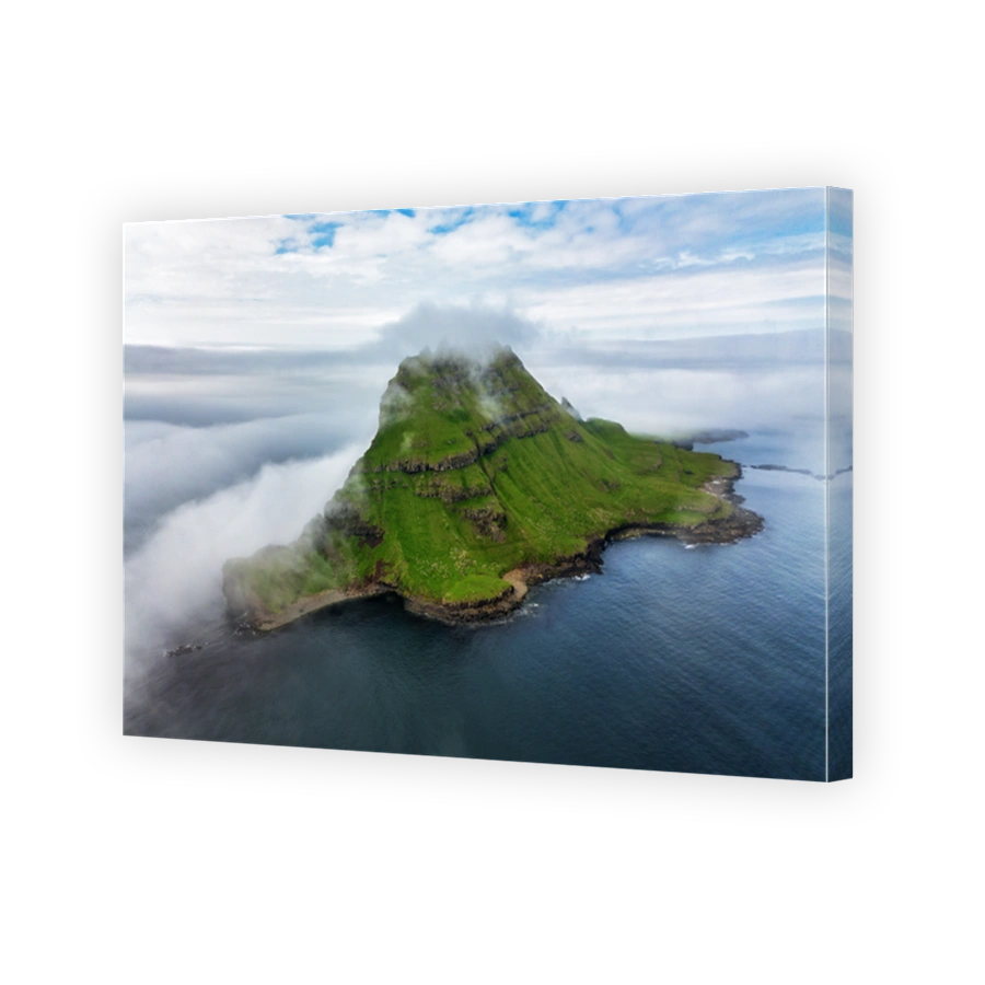 Faroe Islands Vagar, aerial drone view during sunset in North Atlantic Ocean. Faroe Islands, Denmark, Europe. Drangarnir and Tindholmur