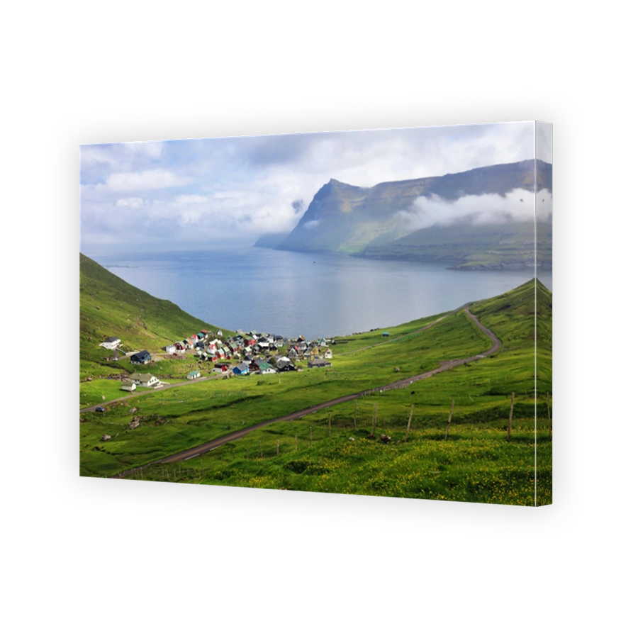 Village over Fog in Funningur fjord on Eysturoy Island, Faroe Islands.