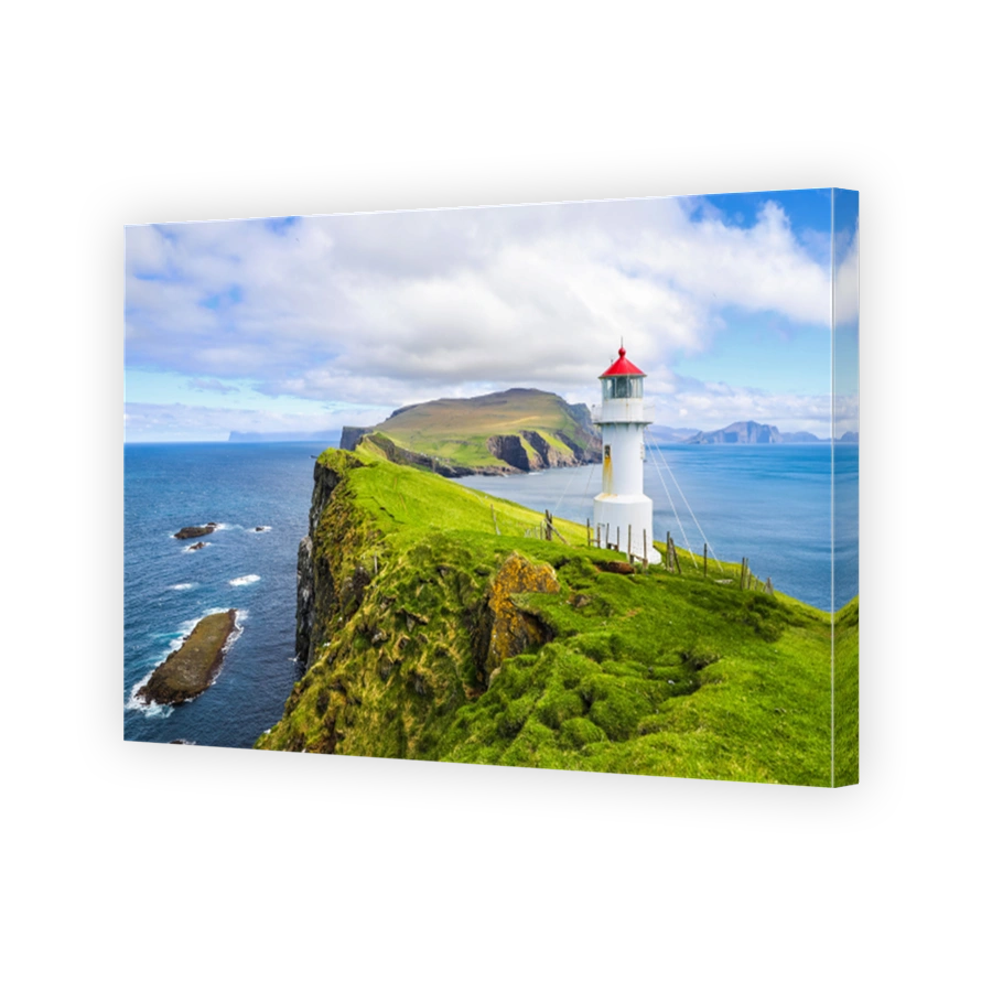 Iconic red and white lighthouse on Mykines Island