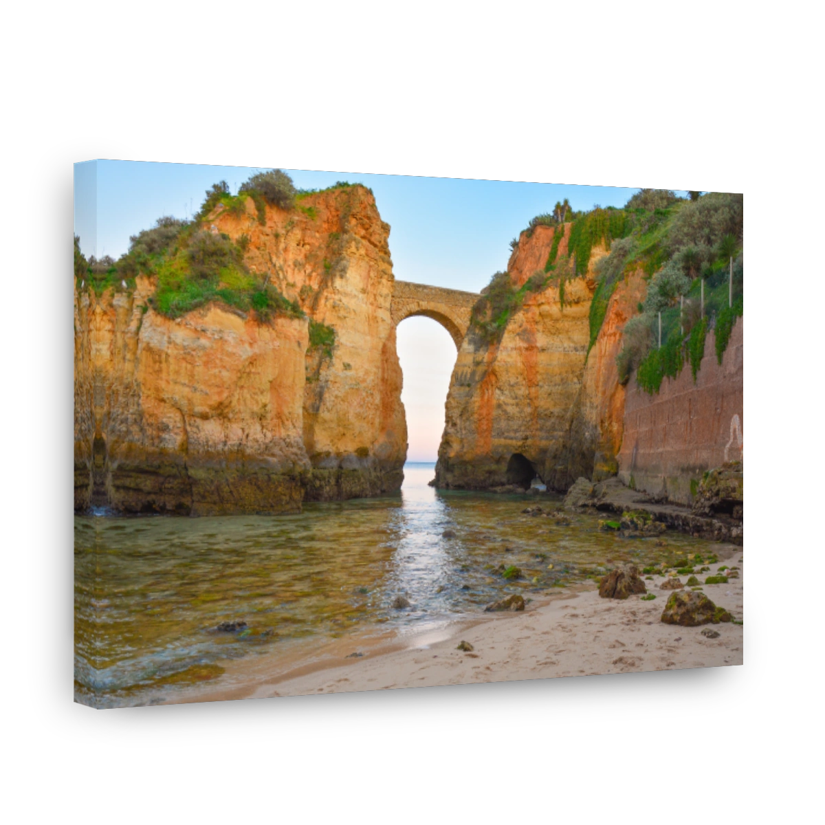 Beautiful arch between the giant cliffs in Praia de Batata, Portugal