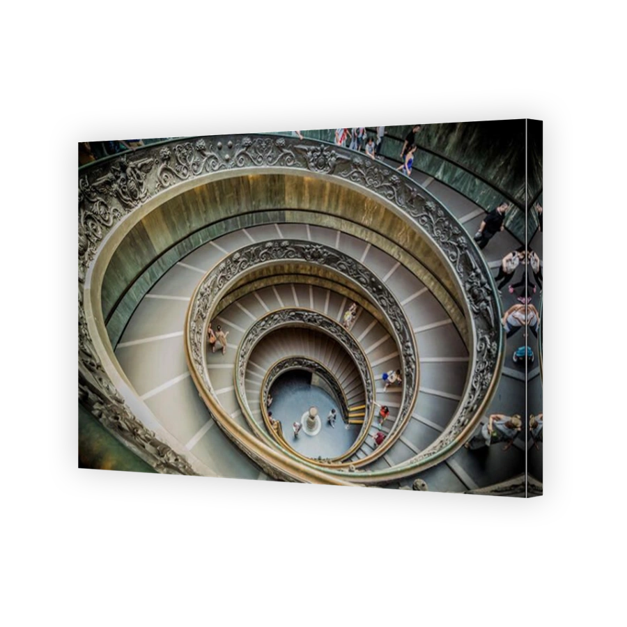 The spiral Bramante staircase and granite Doric column the Vatican Museums designed by Giuseppe Momo. Rome. Italy