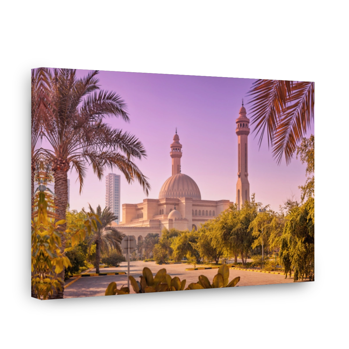 Al Fateh Grand Mosque architecture with minarets framed by palm trees and lush greenery in Manama, Bahrain