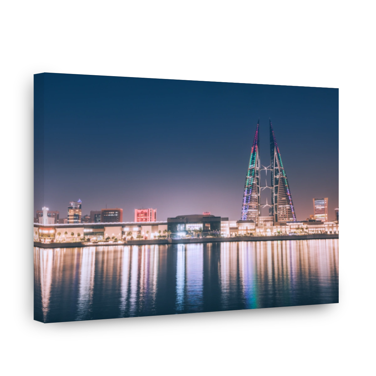 Bahrain buildings and cityscape reflecting colorful lights on water. Travel and development in Manama