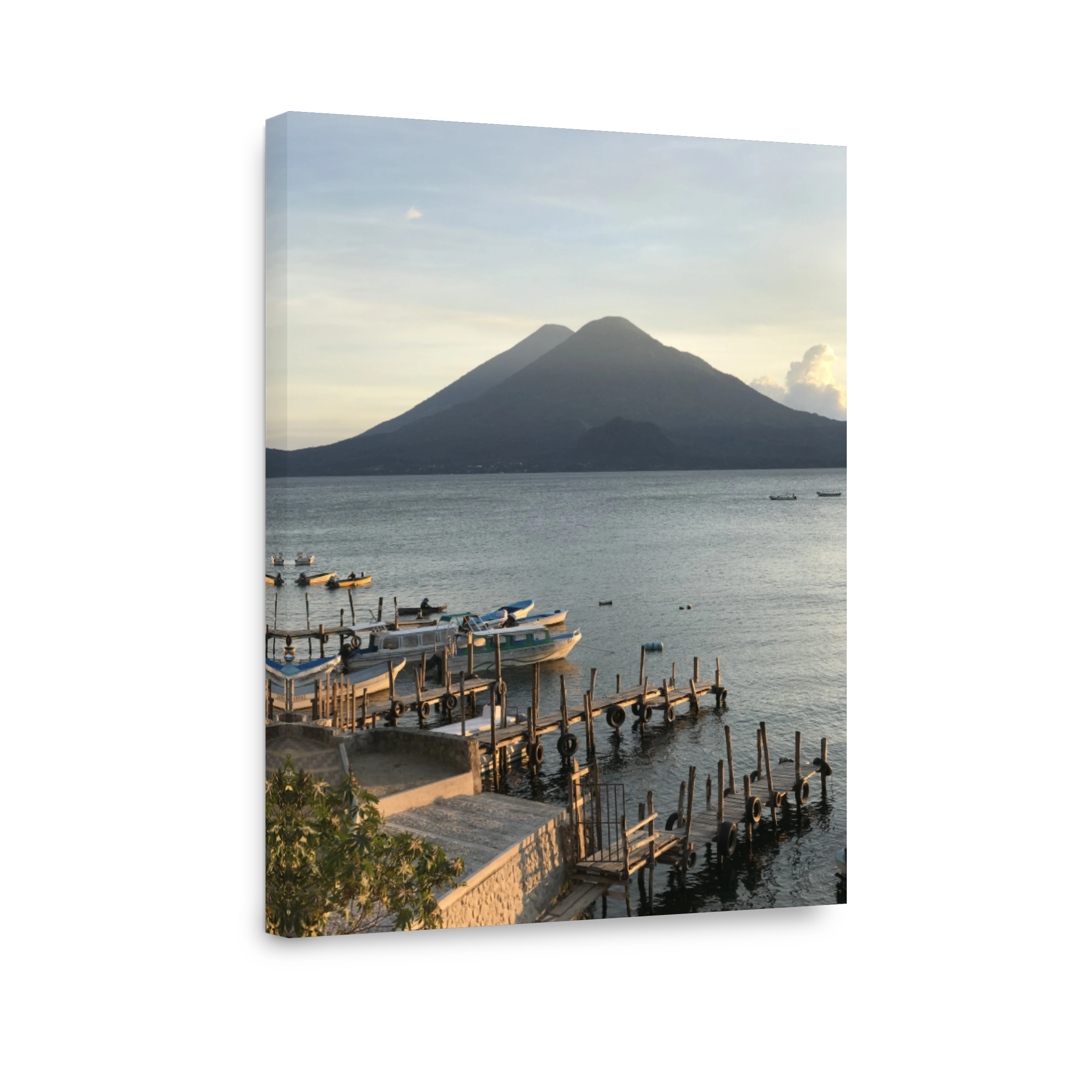 Scenic View Of Lake Atitlan Facing Volcanoa Against Sky During Sunset