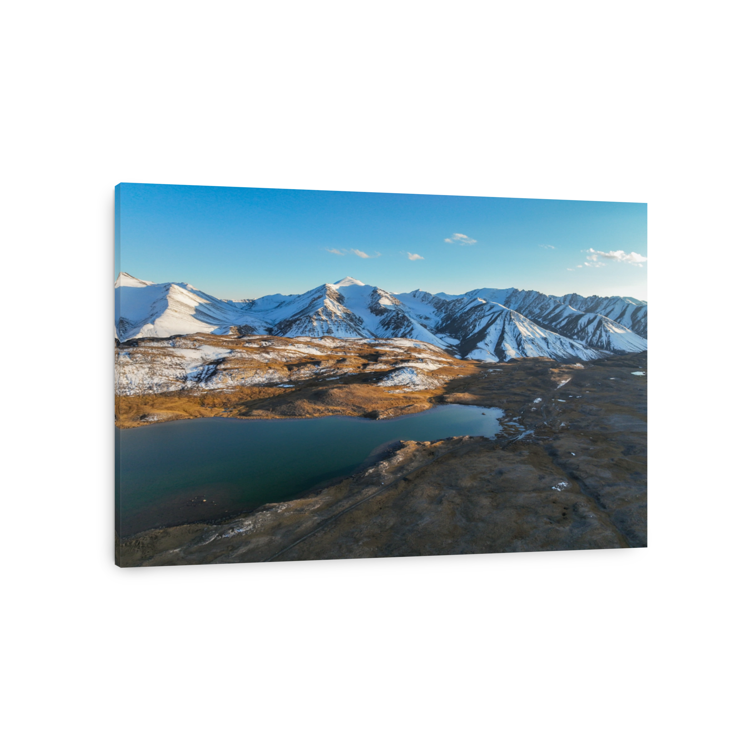 Picturesque mountain lake with a majestic snow-capped range in Kyrgyzstan