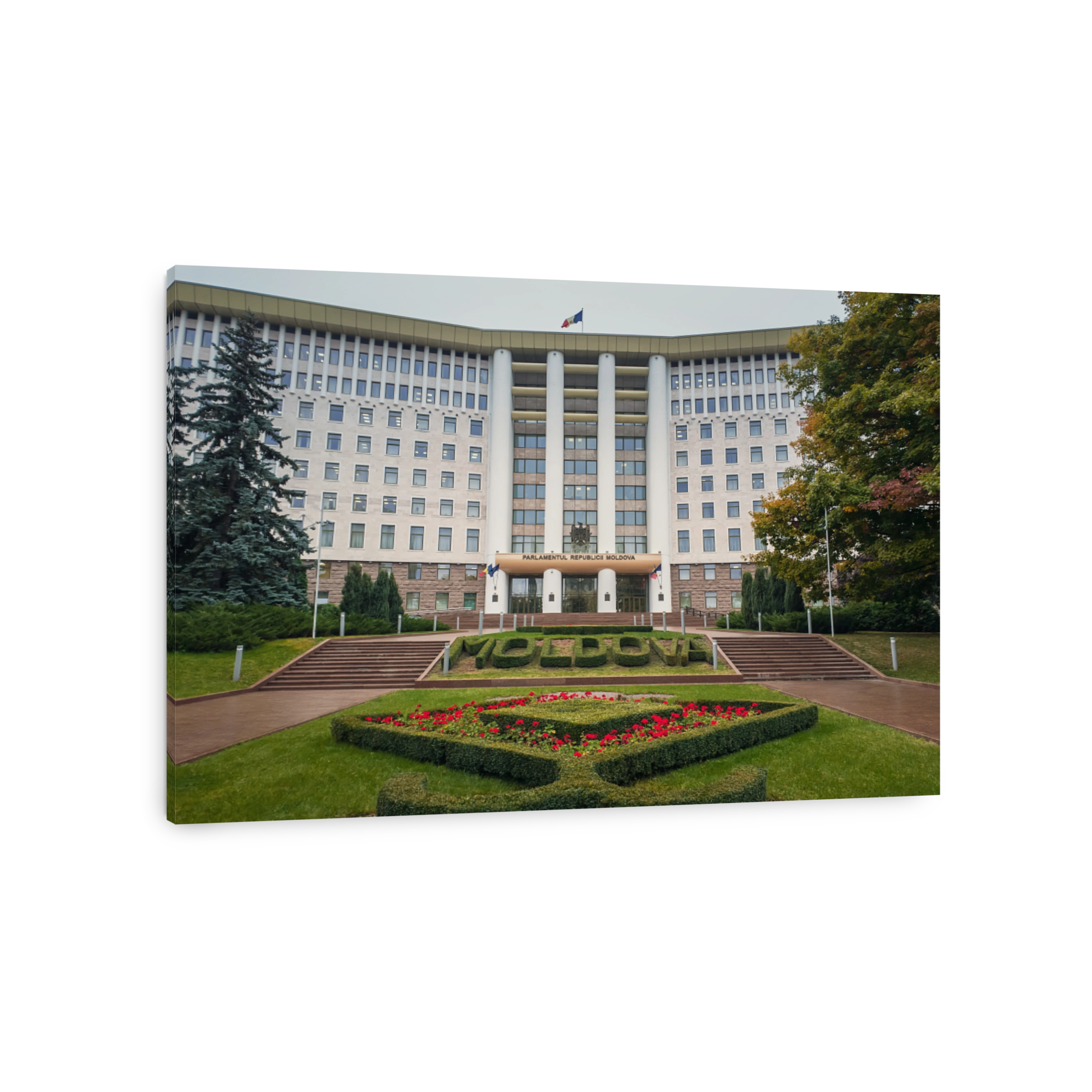 Republic of Moldova parliament building with beautiful garden. Rainy autumn day outdoors.