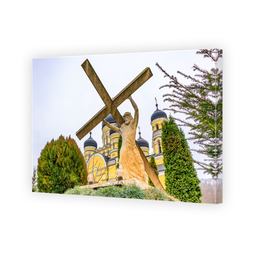 Sculpture Jesus Christ carrying his cross, old monastery Hincu in Moldova. Background with selective focus