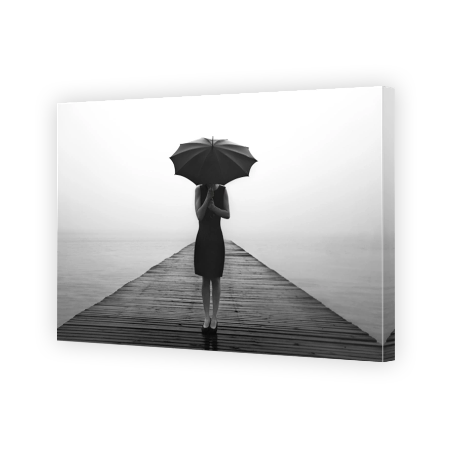 woman contemplates peacefully in front of a mysterious lake