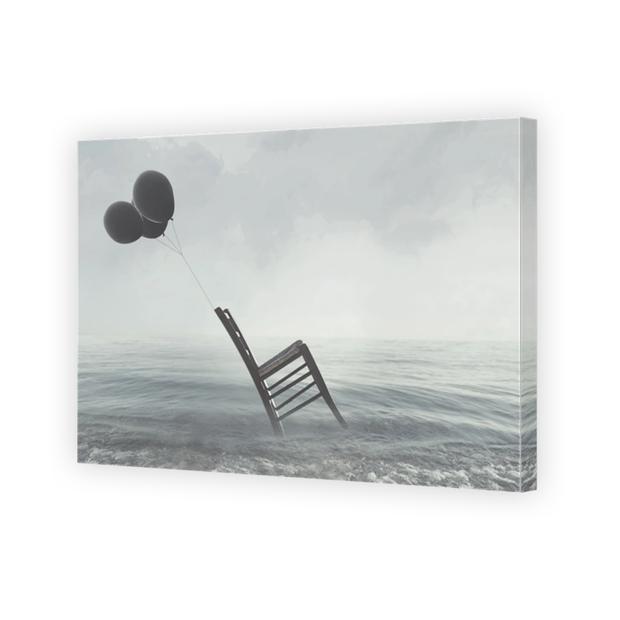 surreal image of a chair held in balance by flying balloons