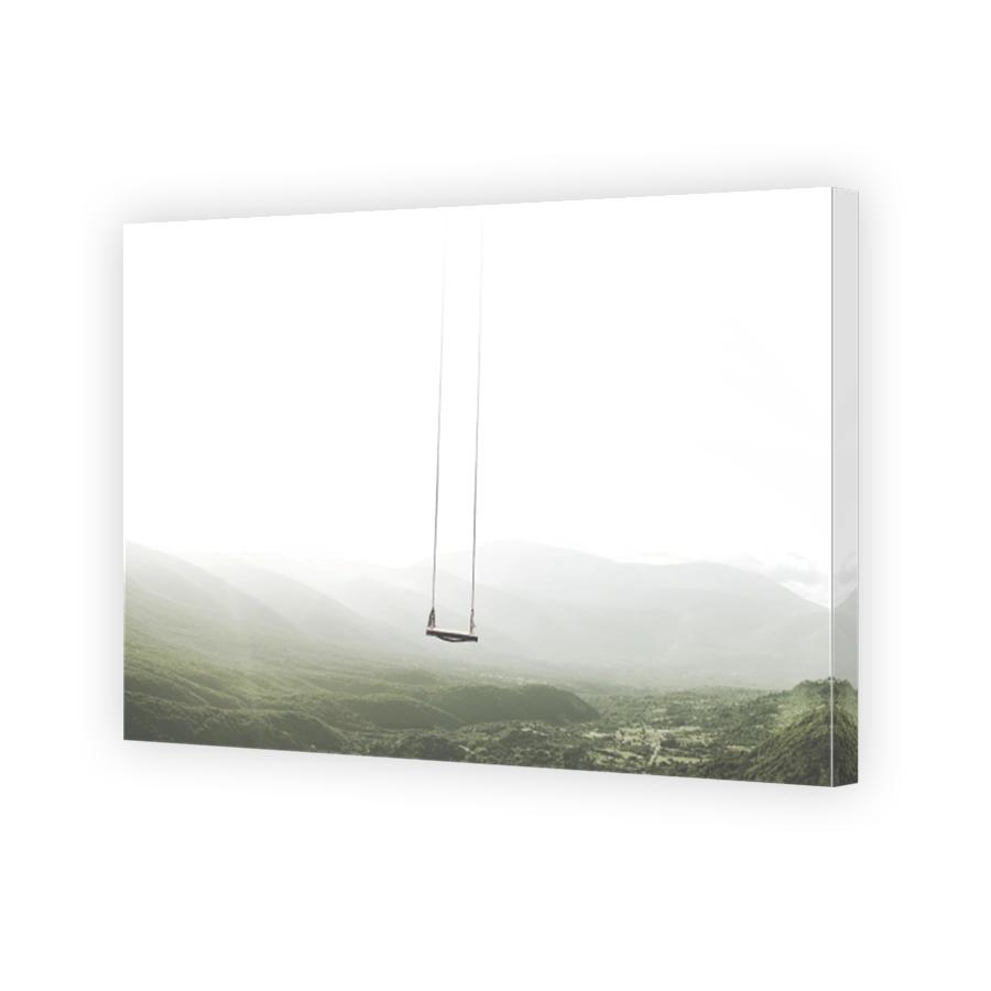 surreal mountain landscape with a swing that moves in the sky