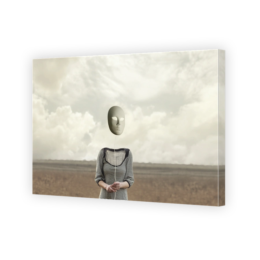 surreal headless person holds a hanging mask from a string
