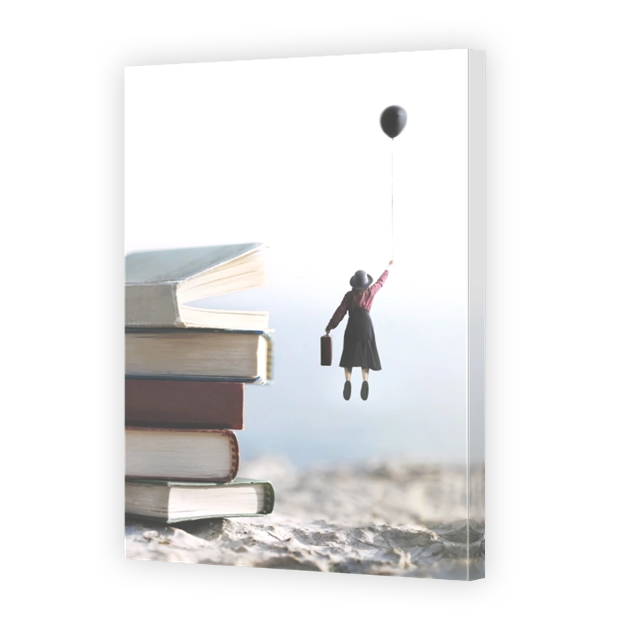 woman carried by a balloon flies above a mountain of giant books