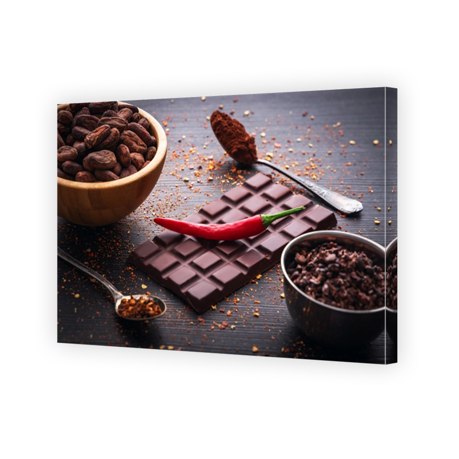 Dark chocolate bar, red hot chilli pepper cayenne,  dry hot chili spices, cocoa beans nibs powder, food tasty design on black wooden background