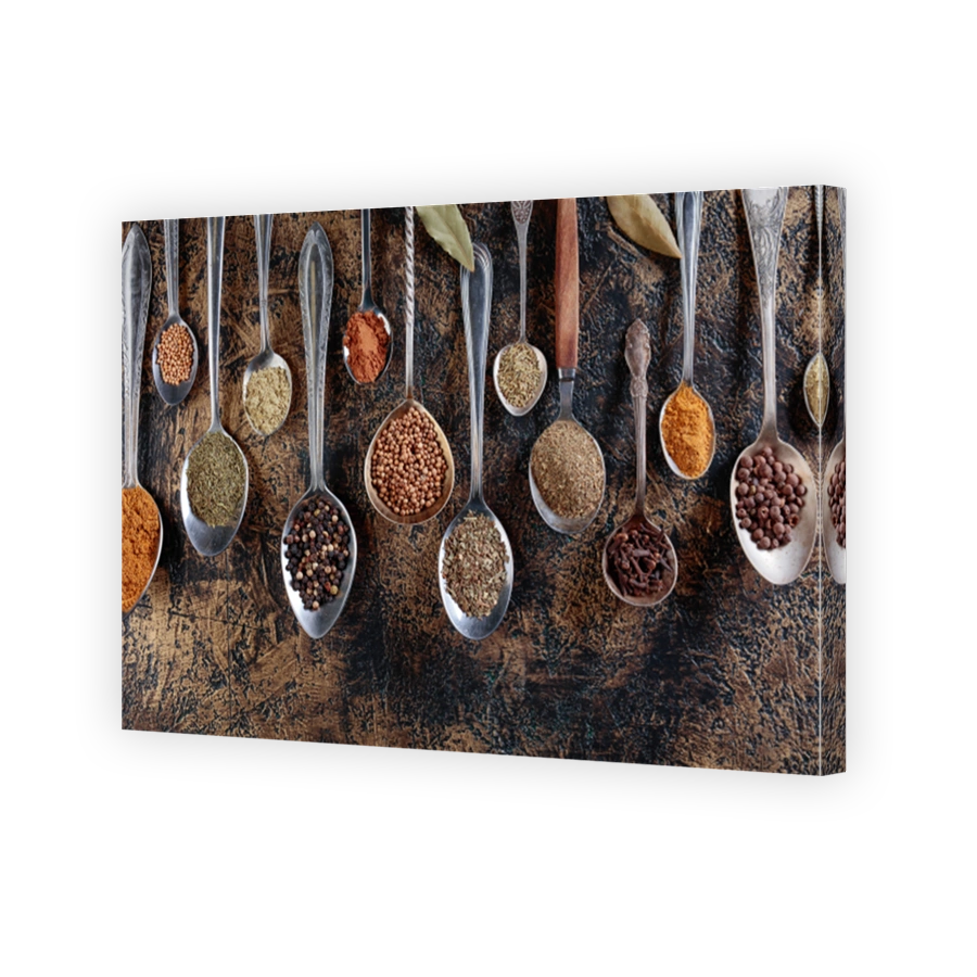 Assortment of spices in vintage spoons