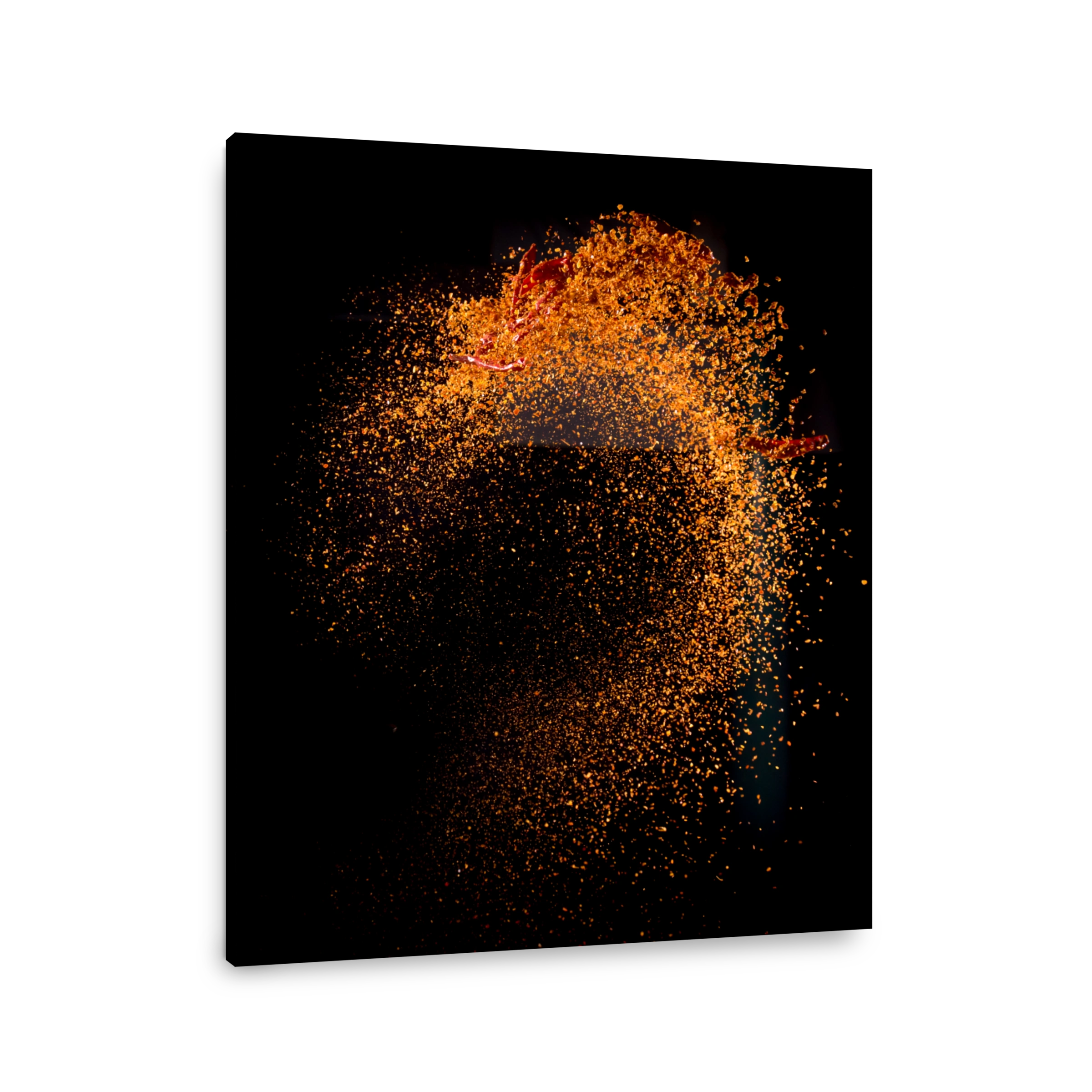 Cayenne pepper powder explosion isolated on black background,Flying Cayenne pepper,Motion blur