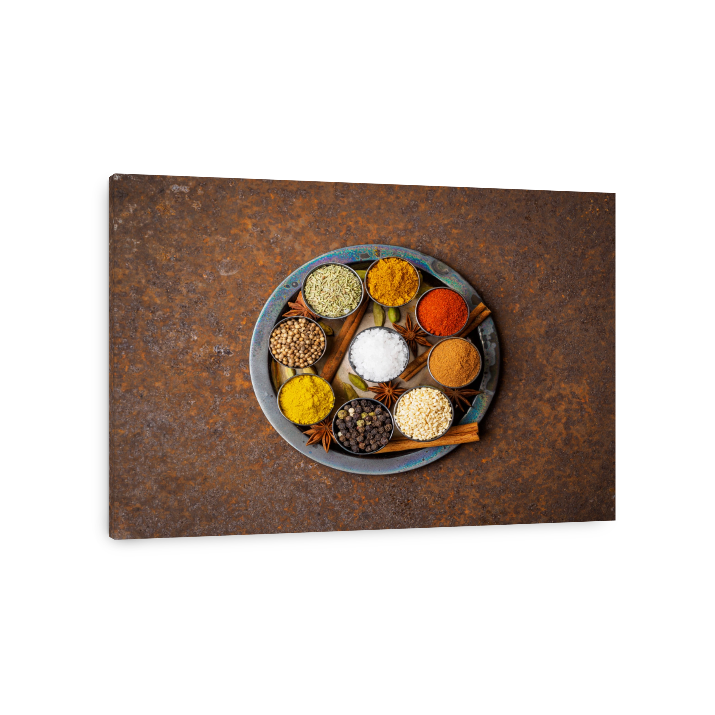 Mix spices on round metal plate - coriander seeds, ground red pepper, salt, black pepper, rosemary, turmeric, curry. Top view, close up, metall rusty background.