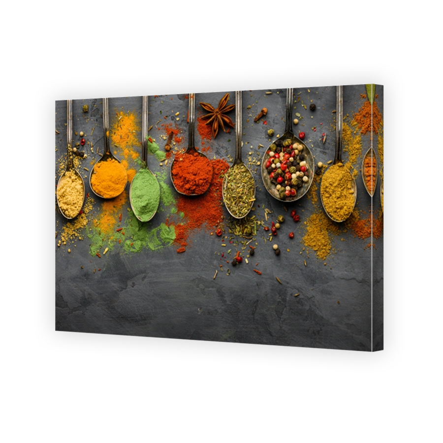 Various seasonings and spices on black stone plate